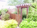 Pergola with picket fence to side
