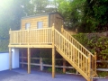 Childrens playhouse constructed from log effect board